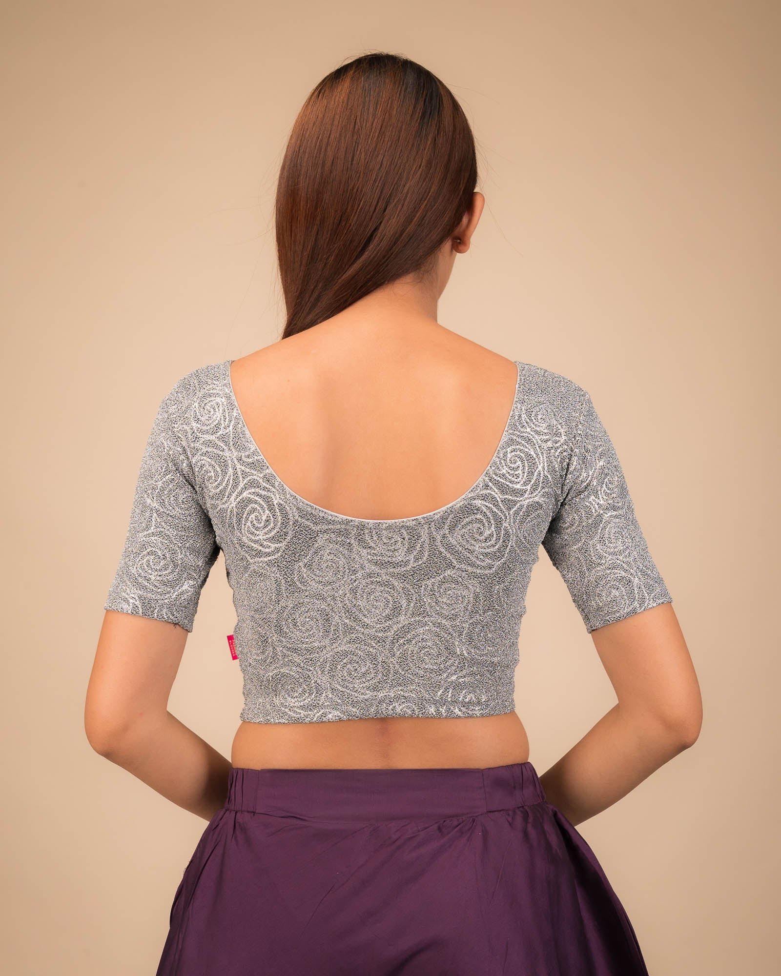  Rear view of the stretchable blouse showcasing the back design.