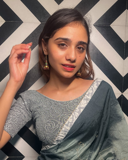 Model pairing the blouse with a saree for a festive ensemble.