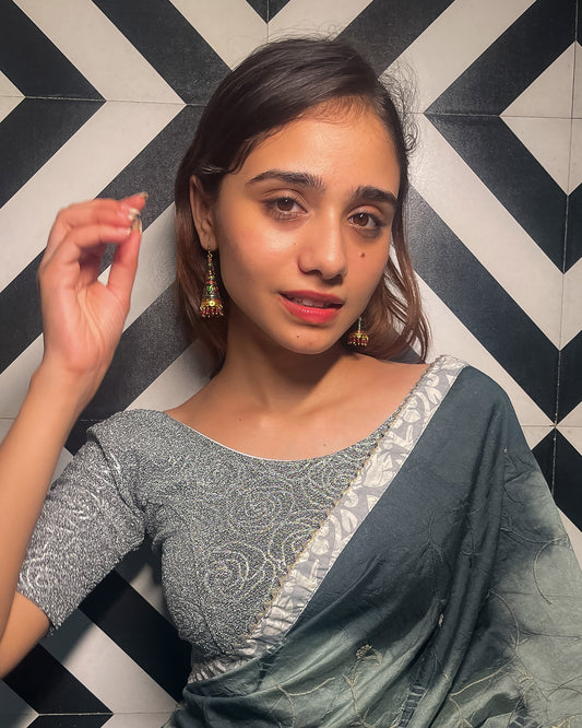 Model pairing the blouse with a saree for a festive ensemble.