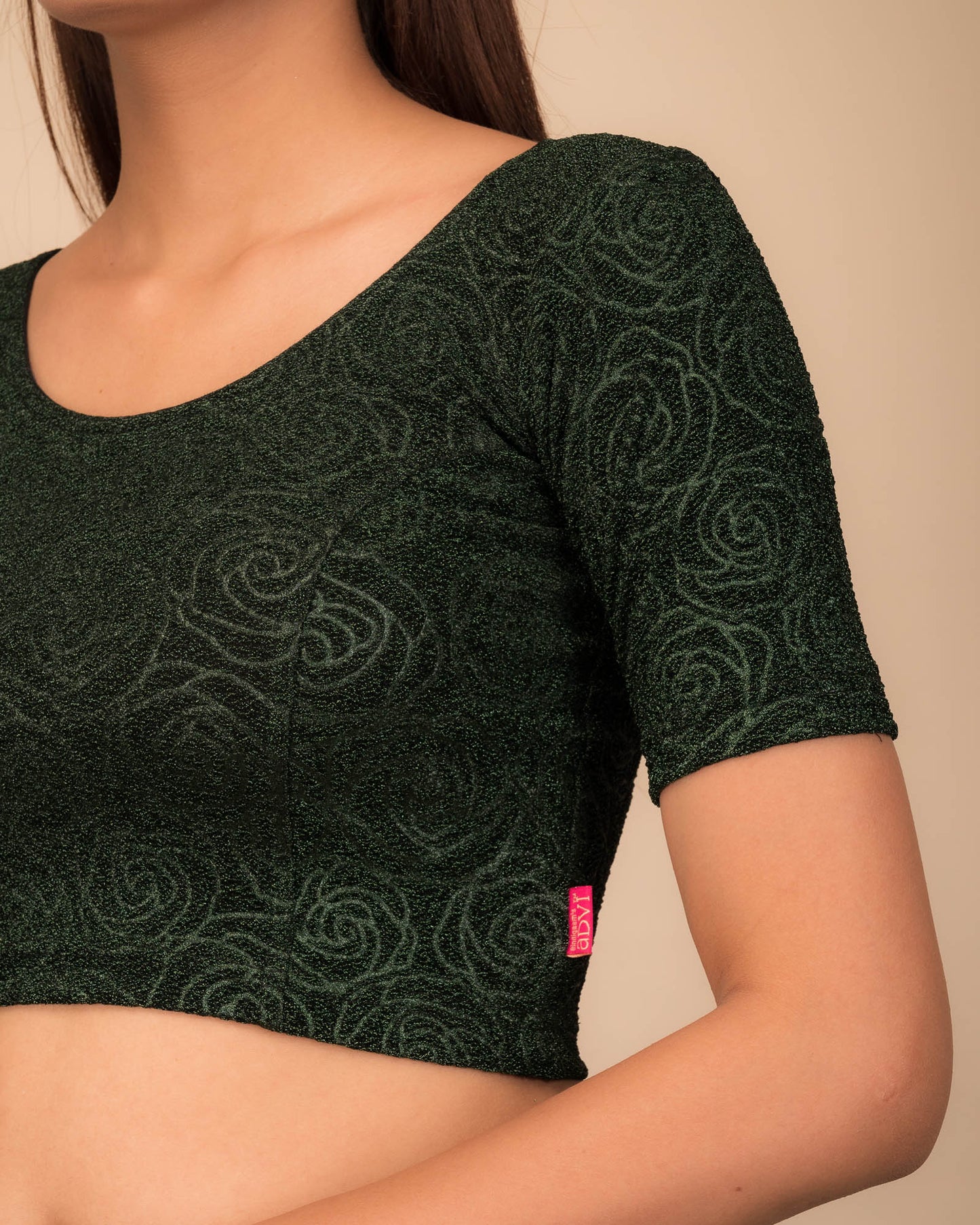 Close-up of the lurex knit fabric with embossed texture.