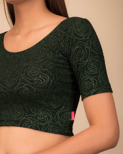 Close-up of the lurex knit fabric with embossed texture.