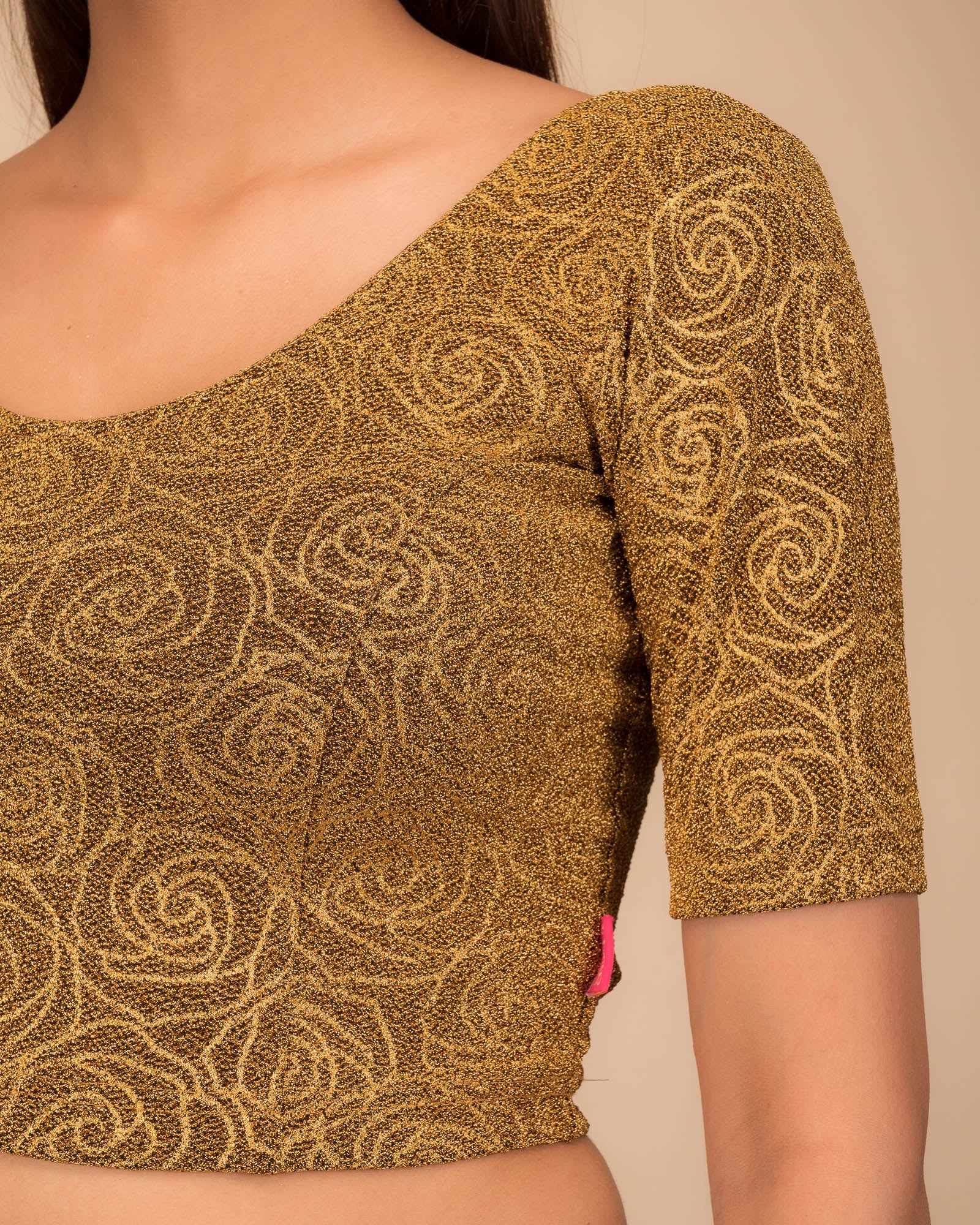 Close-up of the lurex knit fabric with embossed texture.
