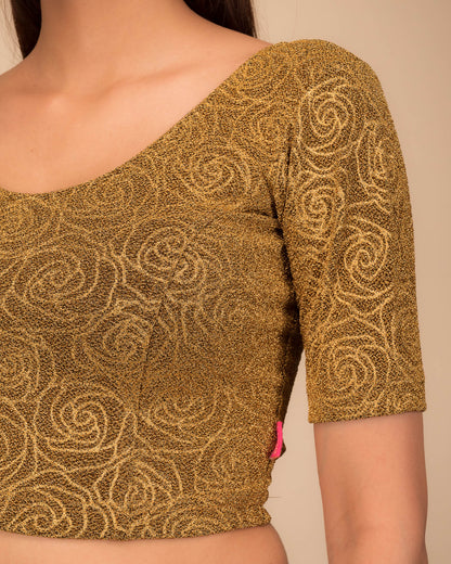 Close-up of the lurex knit fabric with embossed texture.