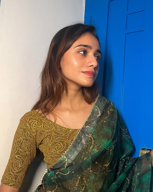 Model pairing the blouse with a saree for a festive ensemble.