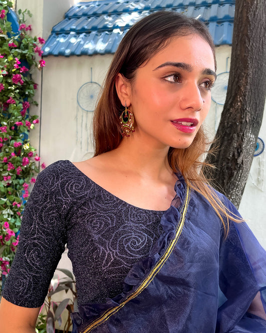Model pairing the blouse with a saree for a festive ensemble.