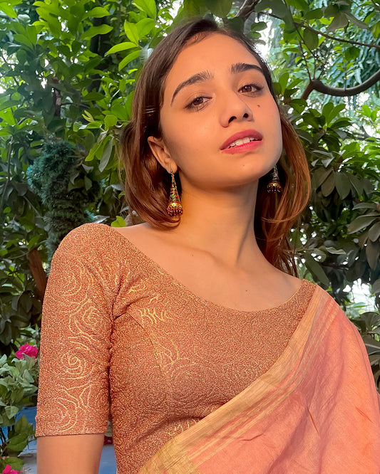 Model pairing the blouse with a saree for a festive ensemble.