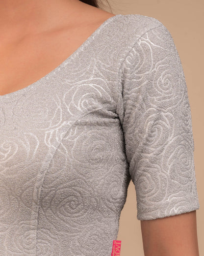 Close-up of the lurex knit fabric with embossed texture.