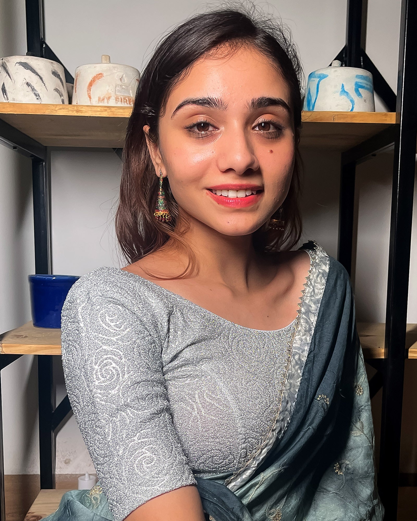 Model pairing the blouse with a saree for a festive ensemble.