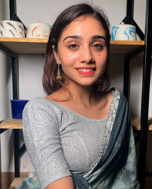 Model pairing the blouse with a saree for a festive ensemble.