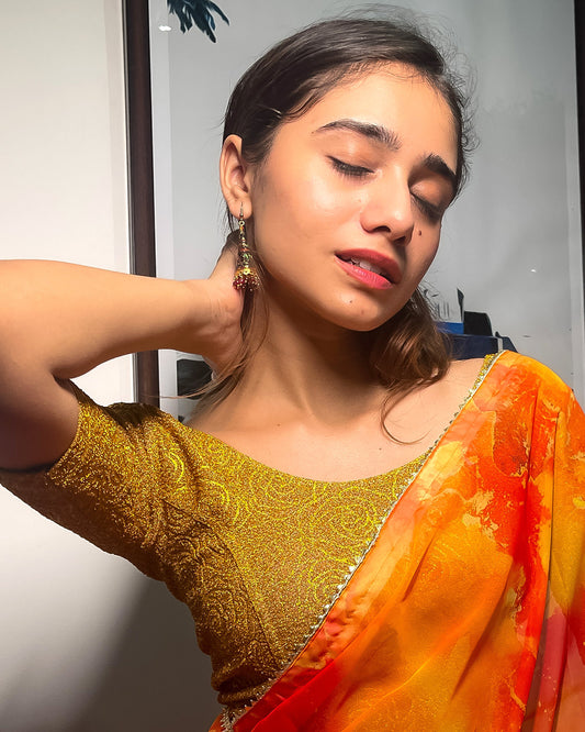 Model pairing the blouse with a saree for a festive ensemble.
