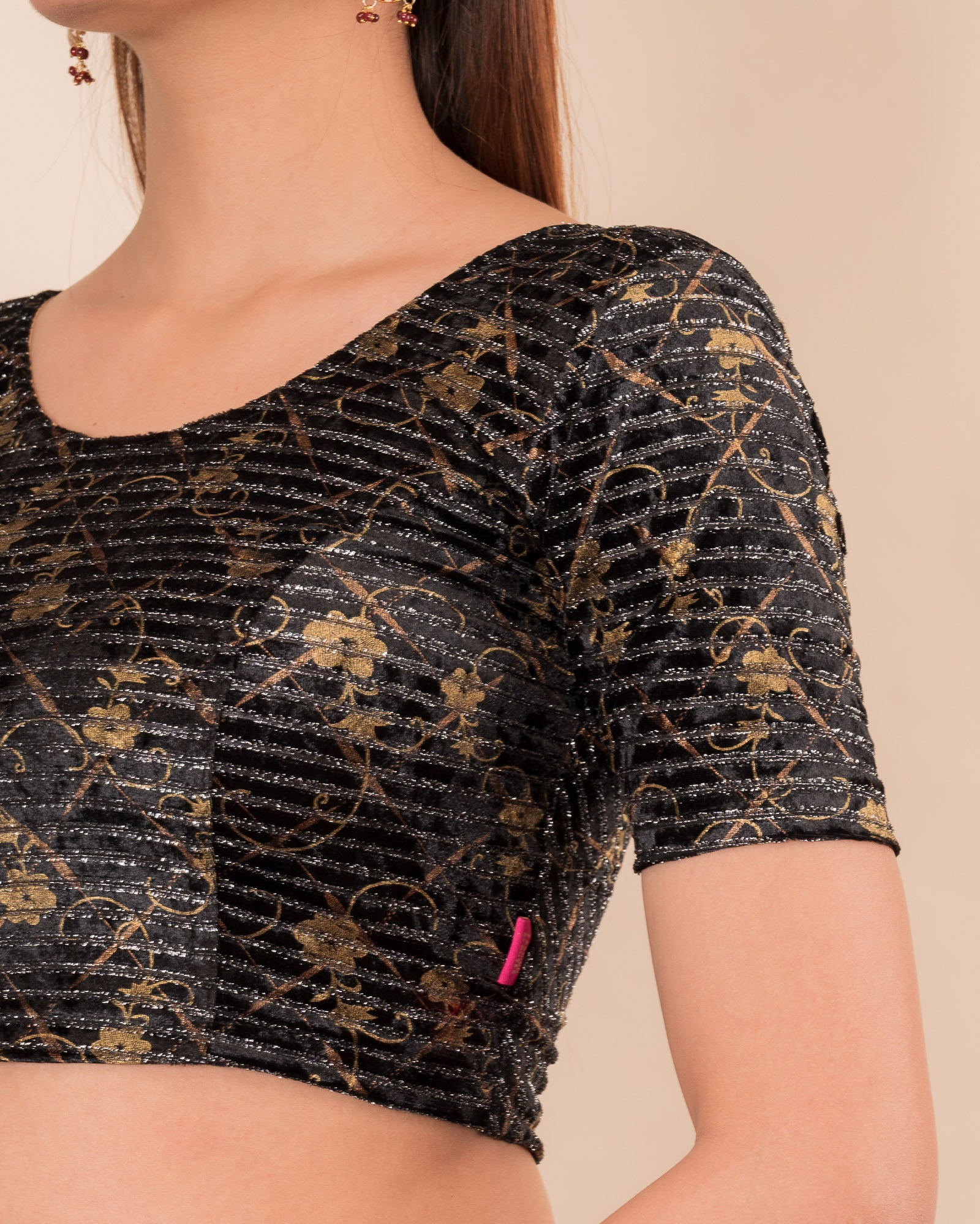 Close-up of velvet fabric with metallic stripe texture