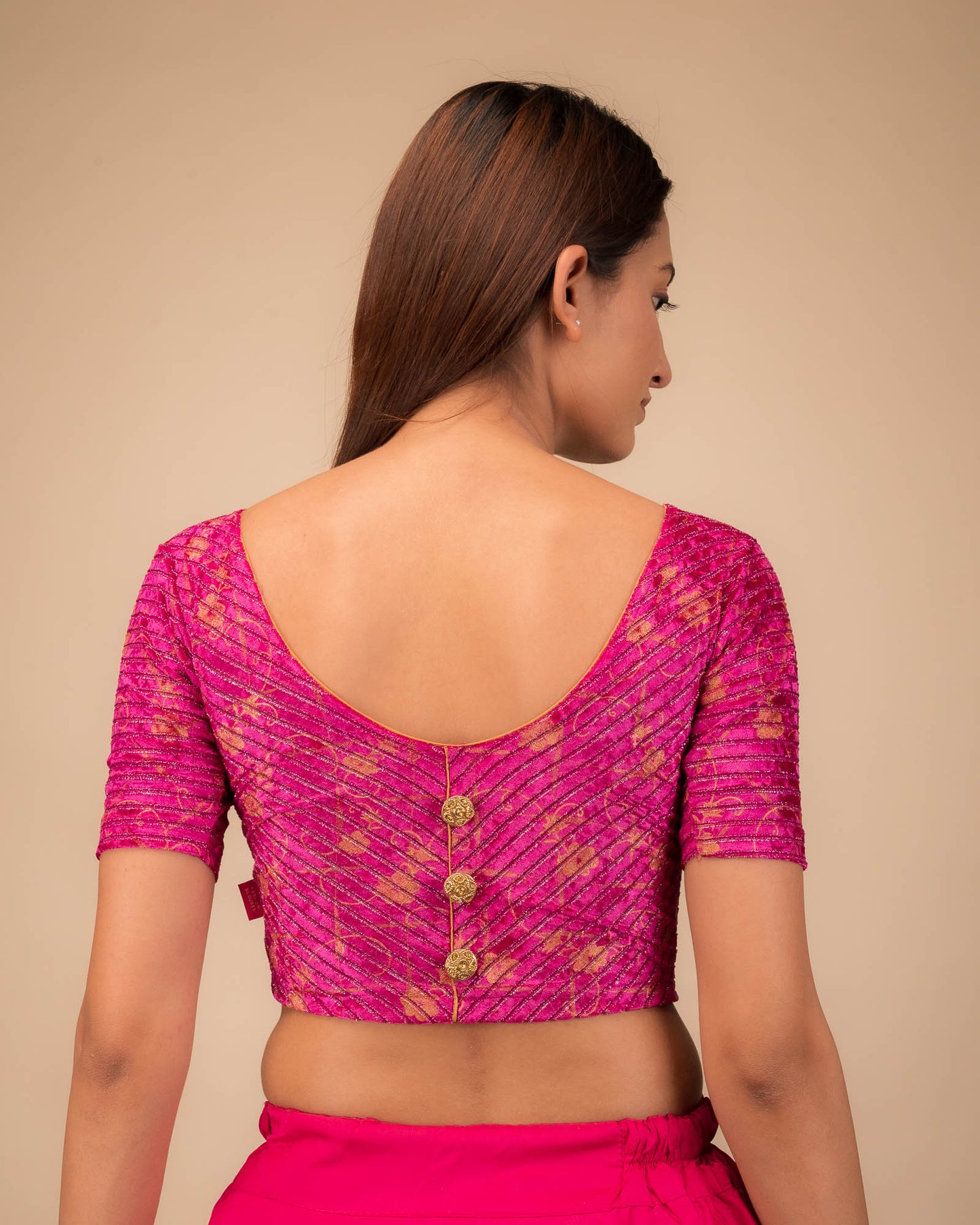 Rear view showcasing the button-back detail.