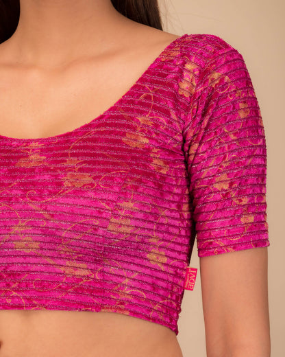 Close-up of velvet fabric with metallic stripe texture.