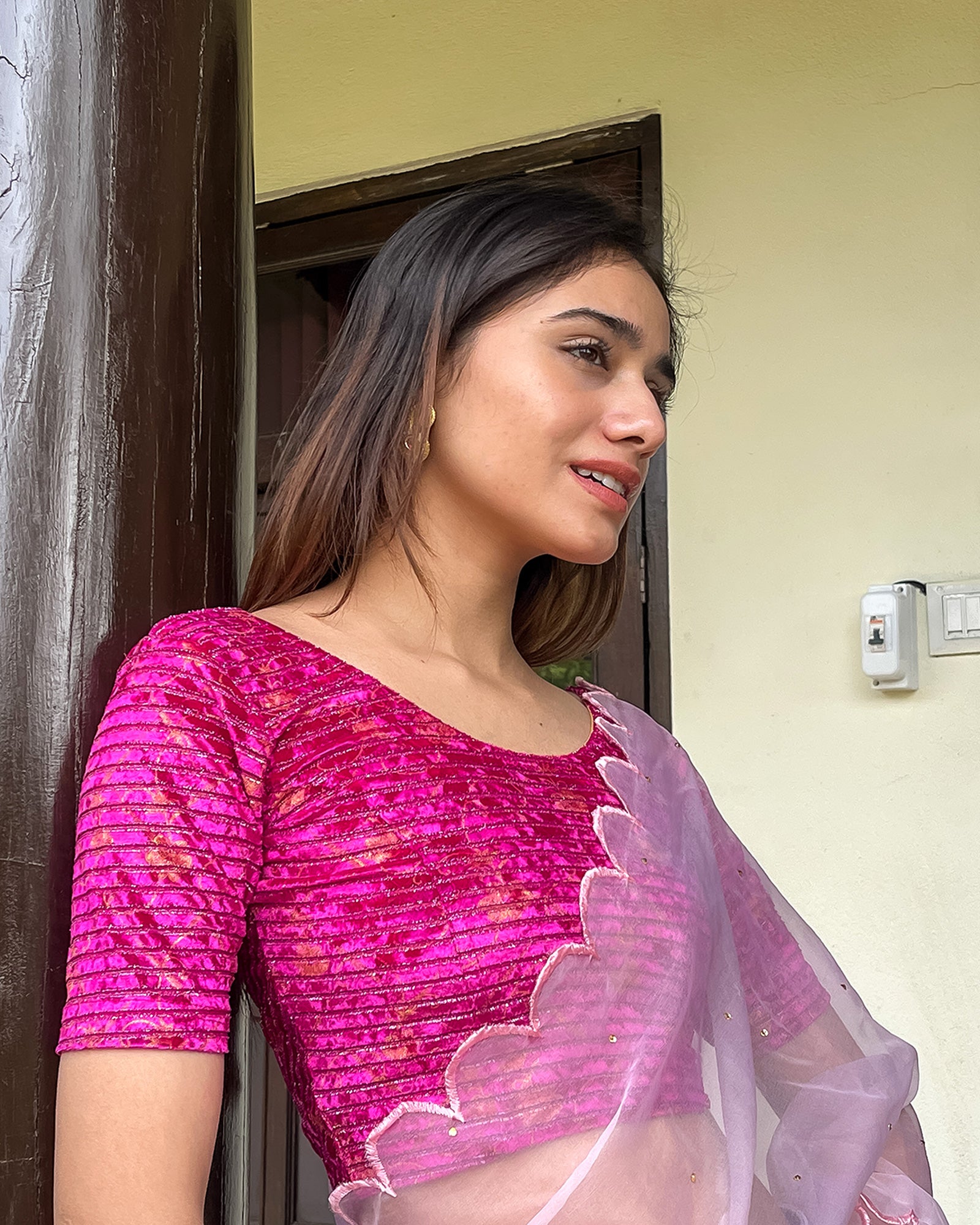 Model pairing the blouse with a saree, demonstrating a festive-ready ensemble.