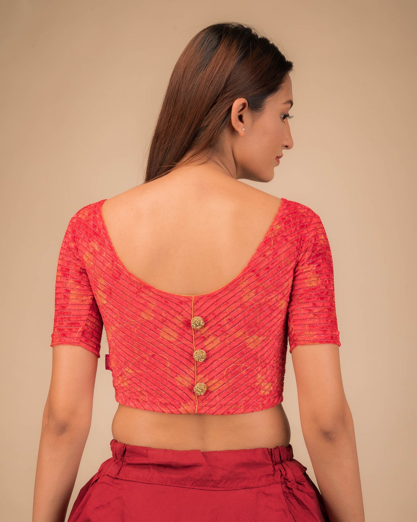 Rear view showcasing the button-back detail.