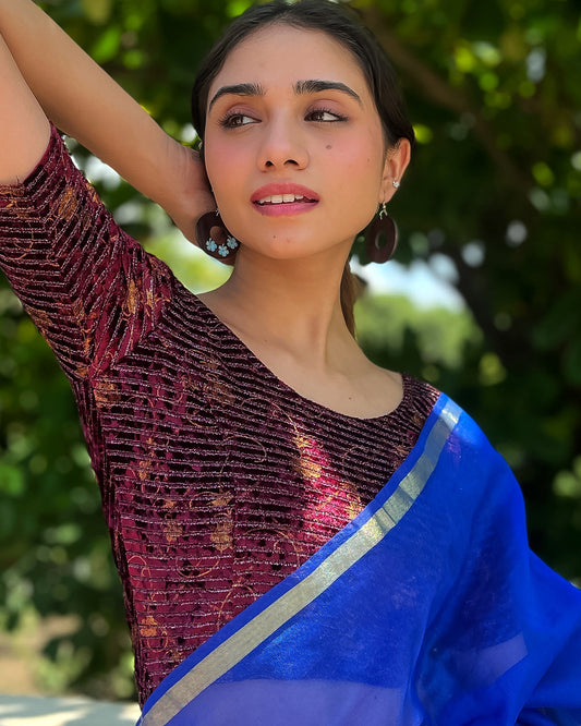 Model pairing the blouse with a saree, demonstrating a festive-ready ensemble.
