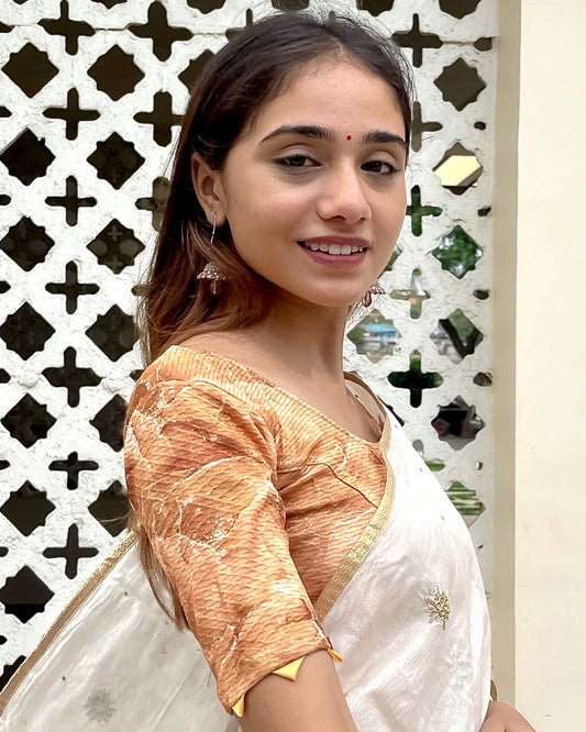 Model pairing the blouse with a saree for a festive-ready look.