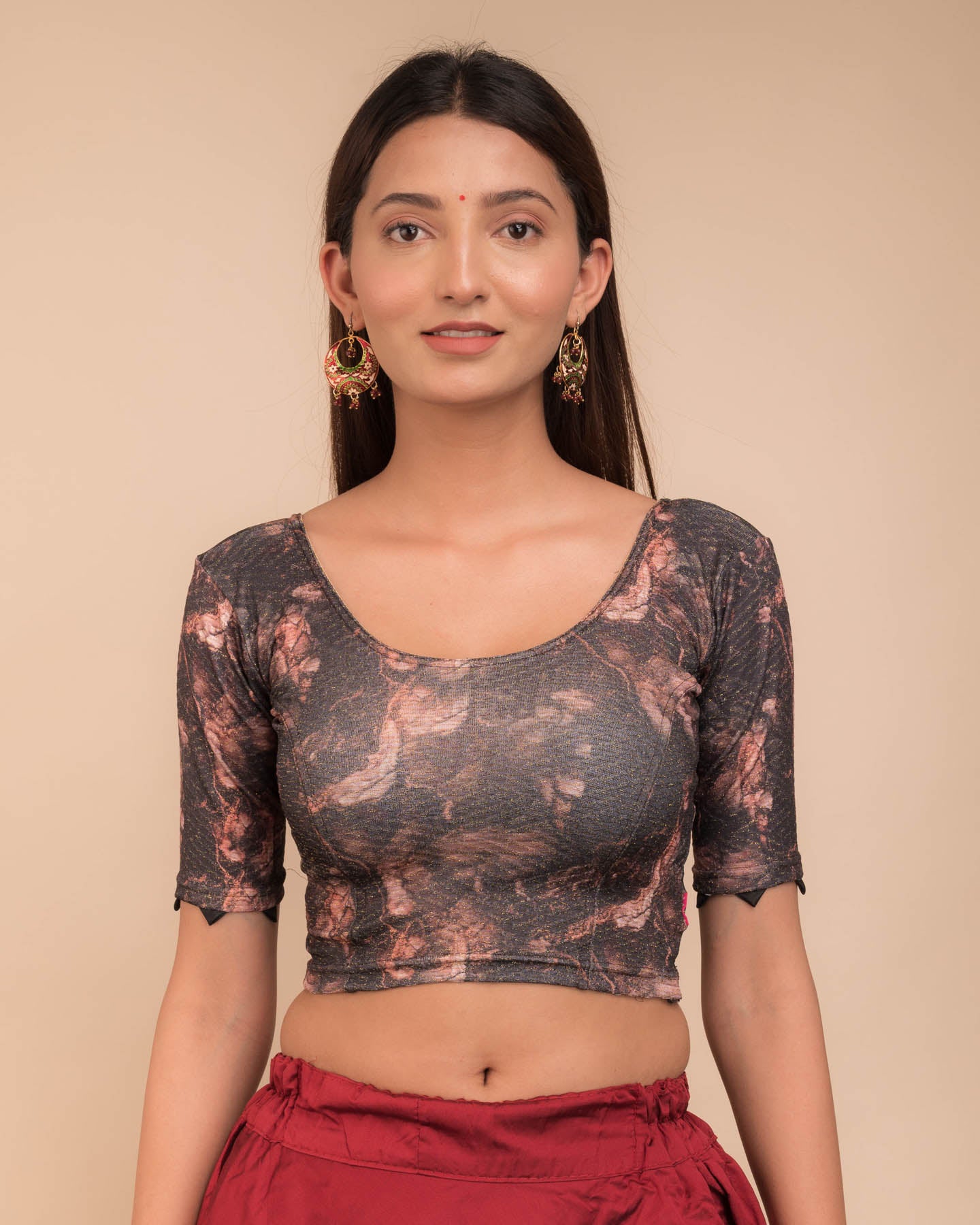 Model wearing a stretchable readymade blouse with elbow sleeves and round neckline, showcasing marbling print.
