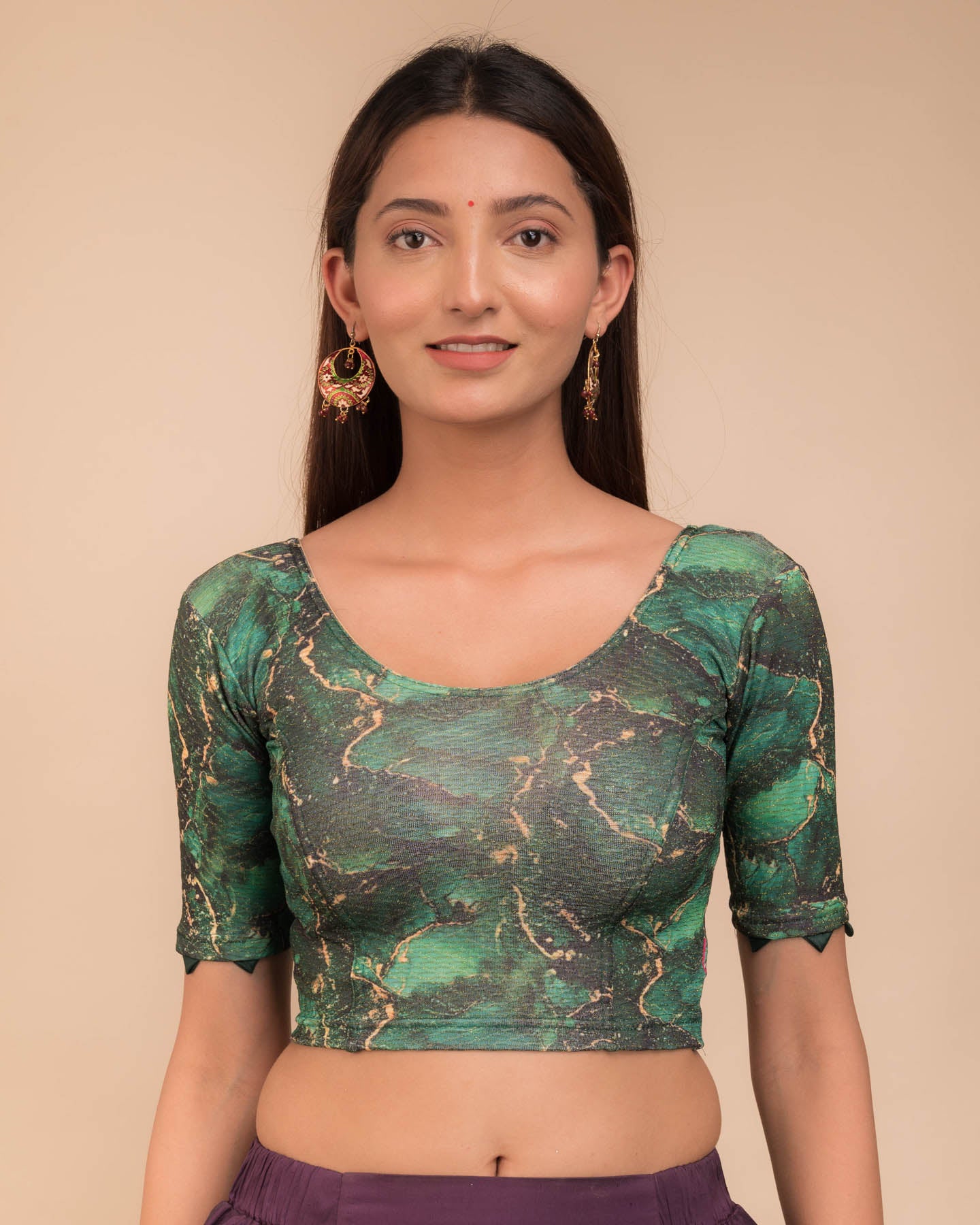 Model wearing a stretchable readymade blouse with elbow sleeves and round neckline, showcasing marbling print.