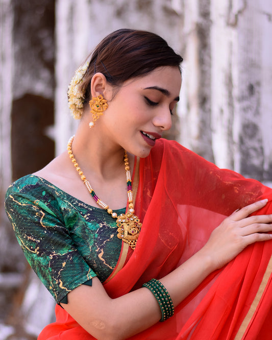 Model pairing the blouse with a saree for a festive-ready look.