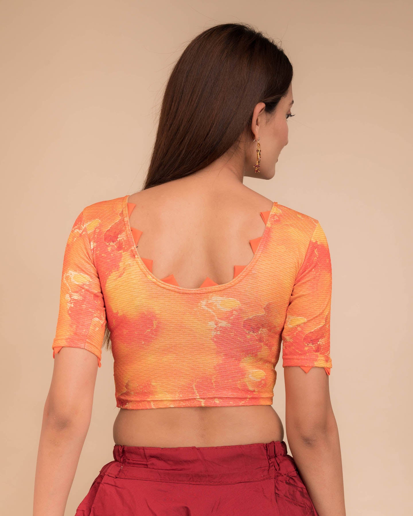 Rear view highlighting the silk trims at sleeves and back neckline.