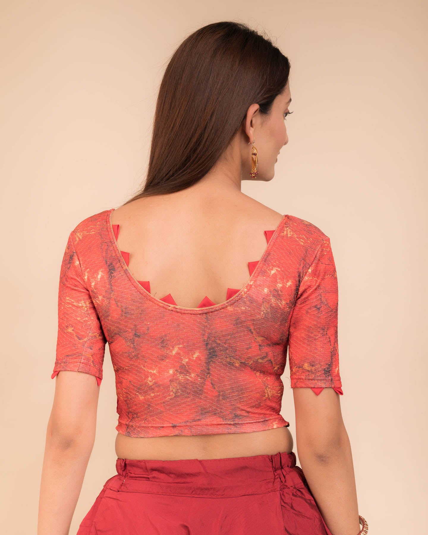 Rear view highlighting the silk trims at sleeves and back neckline.