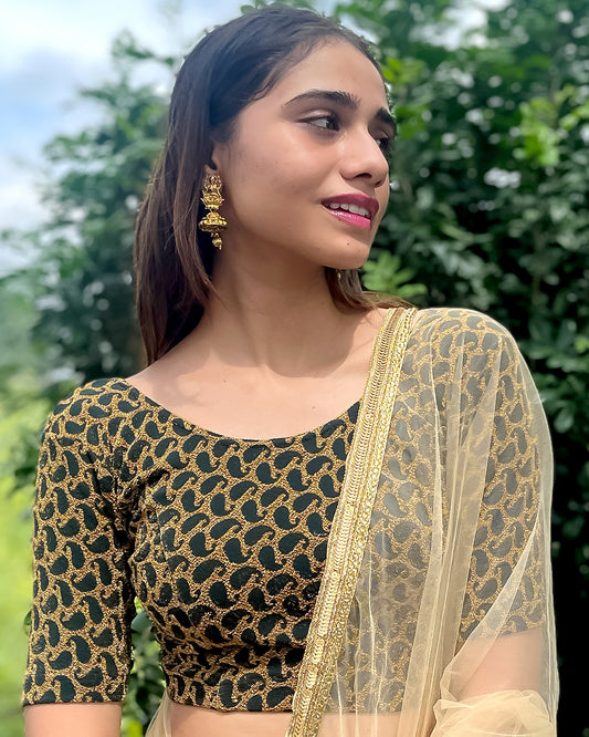 Model pairing the blouse with a saree for a festive look.