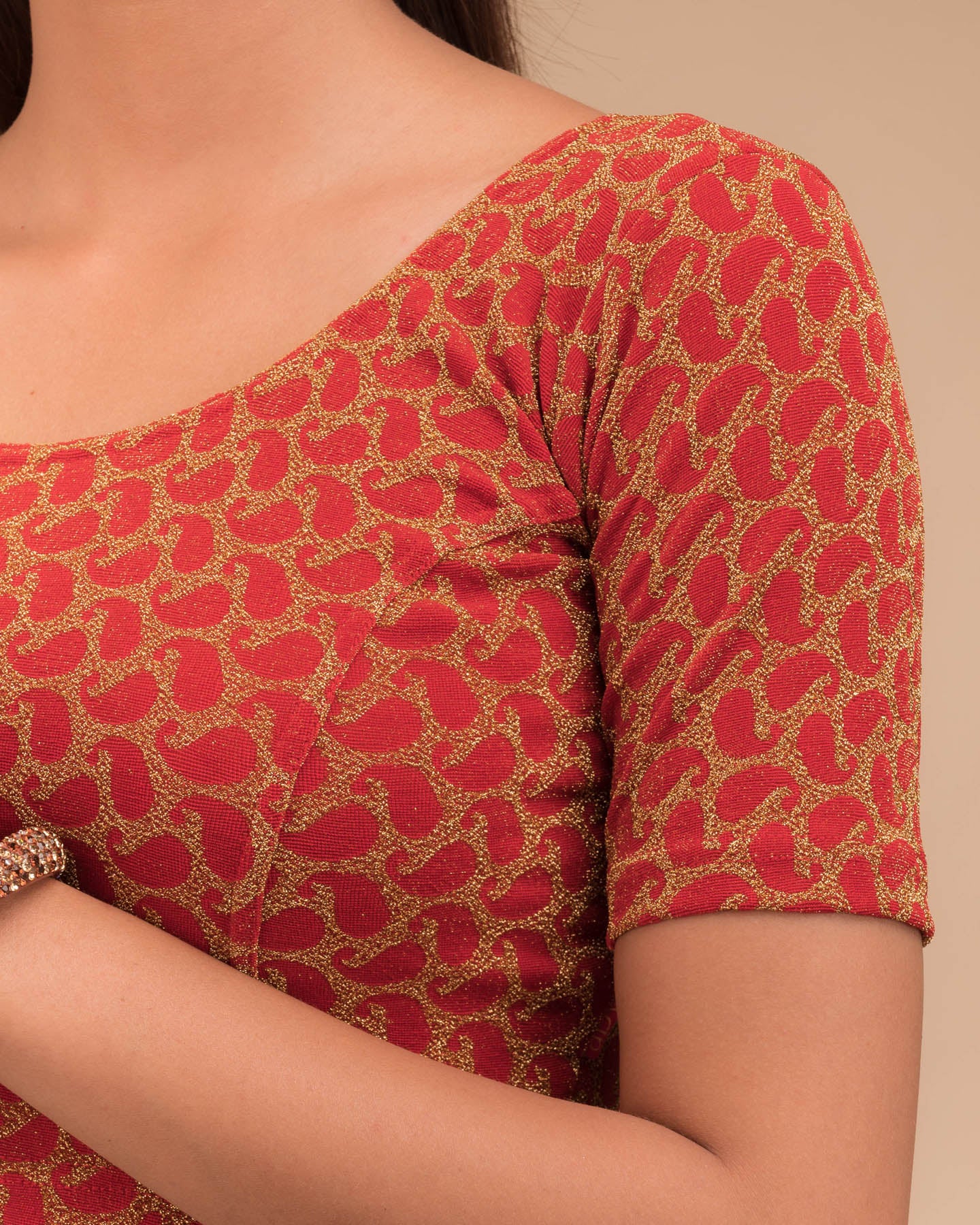 Close-up of jacquard fabric with zari pattern.