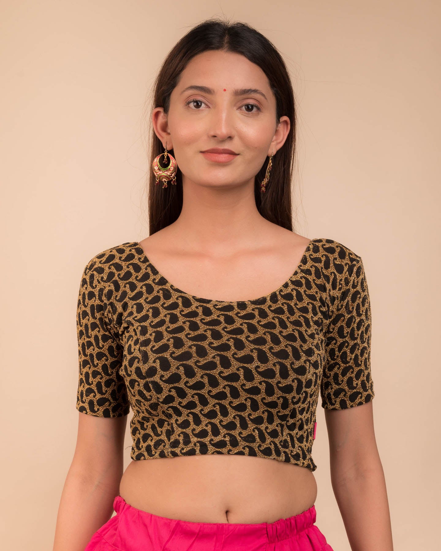 Model wearing a stretchable blouse with elbow sleeves and round neckline, featuring zari detailing.