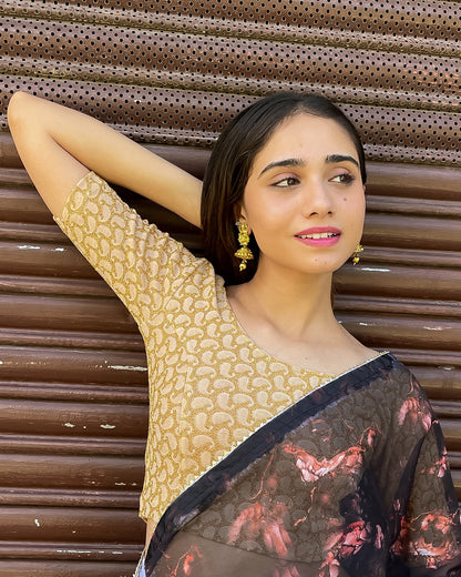 Model pairing the blouse with a saree for a festive look.
