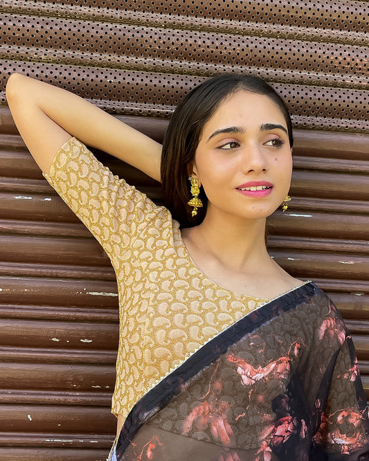 Model pairing the blouse with a saree for a festive look.