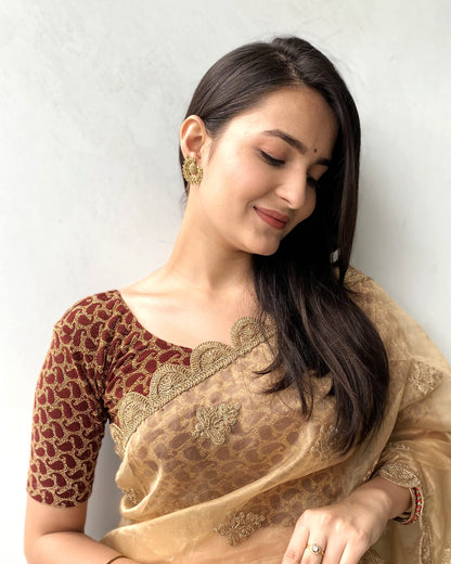 Model pairing the blouse with a saree for a festive look.