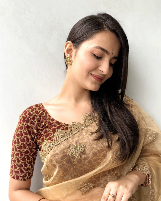 Model pairing the blouse with a saree for a festive look.