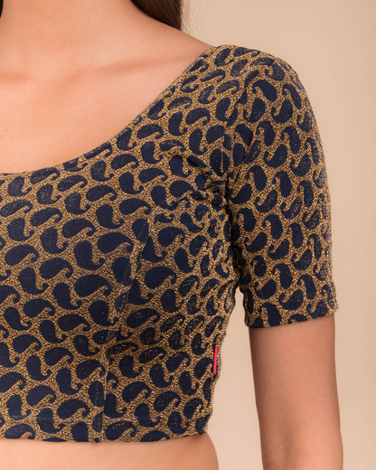 Close-up of jacquard fabric with zari pattern.