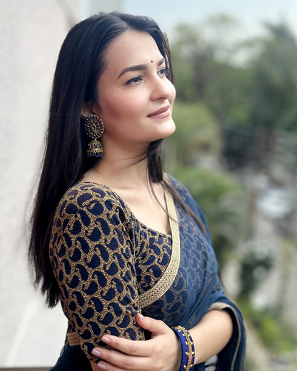 Model pairing the blouse with a saree for a festive look.