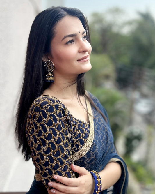 Model pairing the blouse with a saree for a festive look.