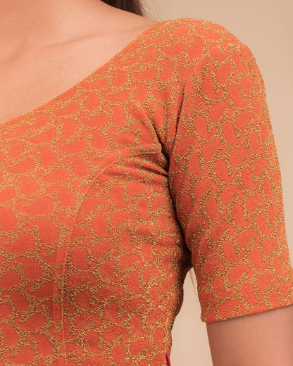 Close-up of jacquard fabric with zari pattern.
