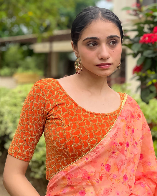 Model pairing the blouse with a saree for a festive look.