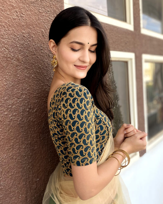 Model pairing the blouse with a saree for a festive look.