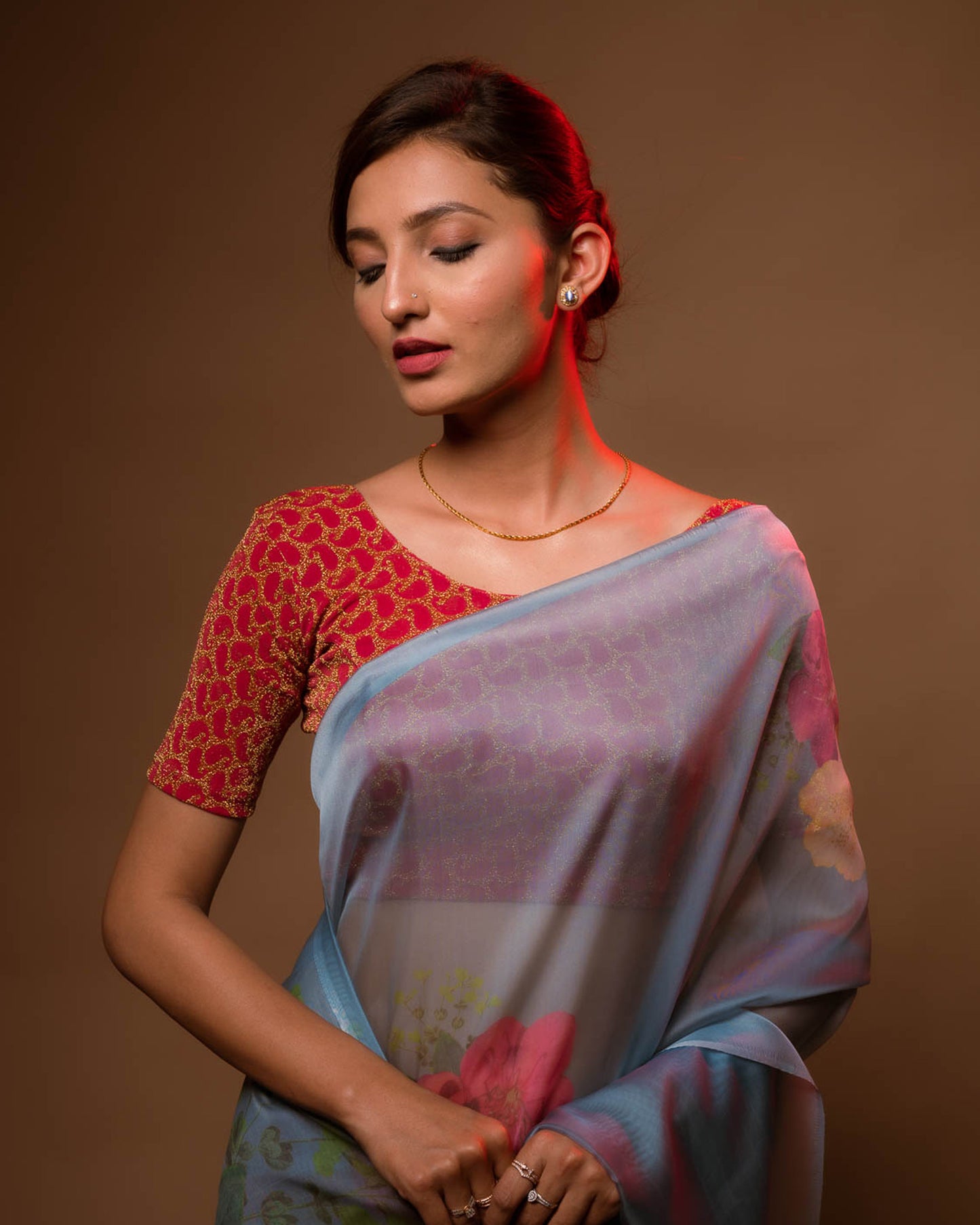 Model pairing the blouse with a saree for a festive look.