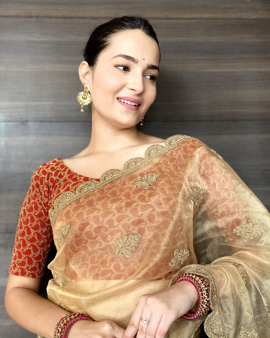 Model pairing the blouse with a saree for a festive look.