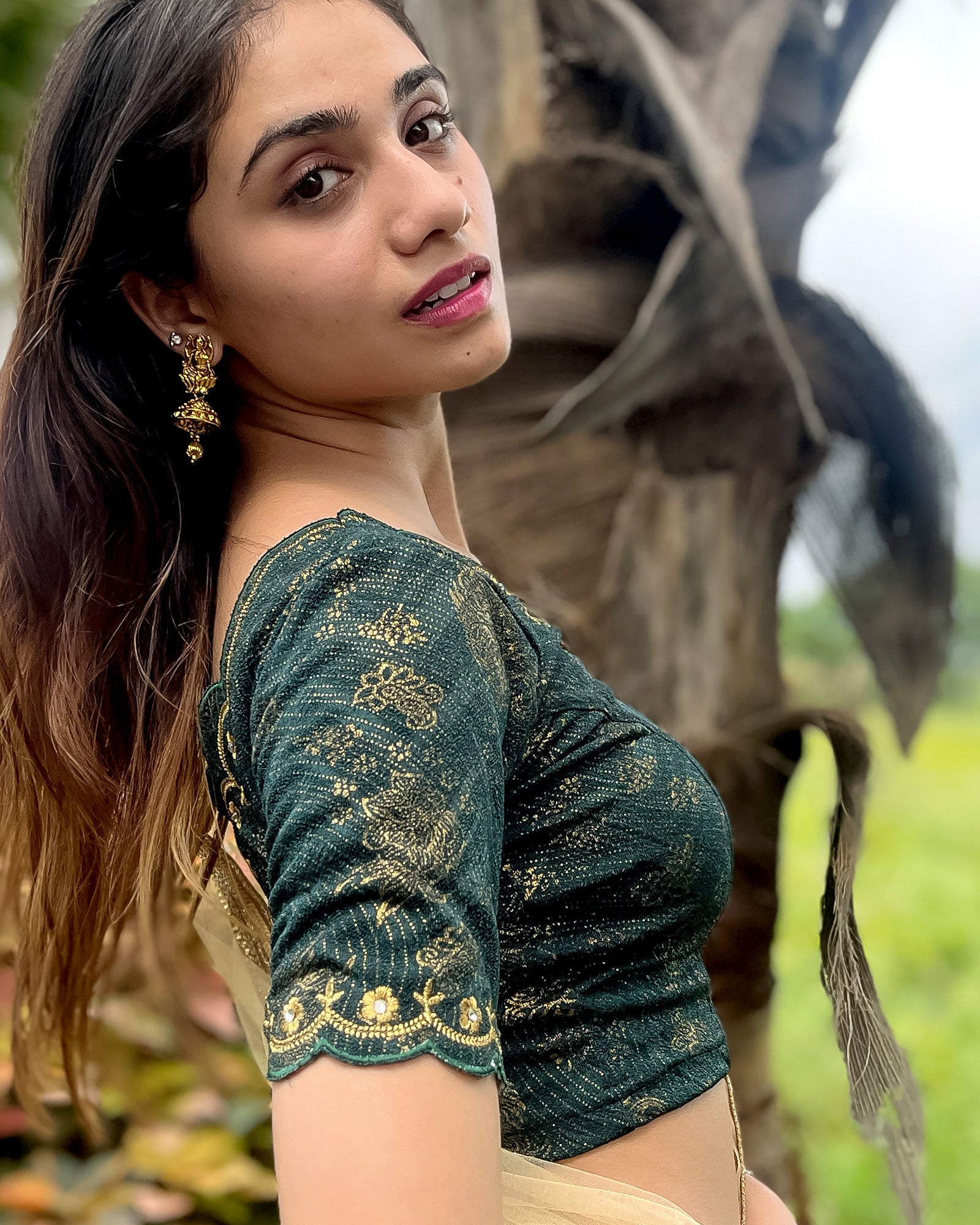 Model pairing the blouse with a saree for a festive-ready look.