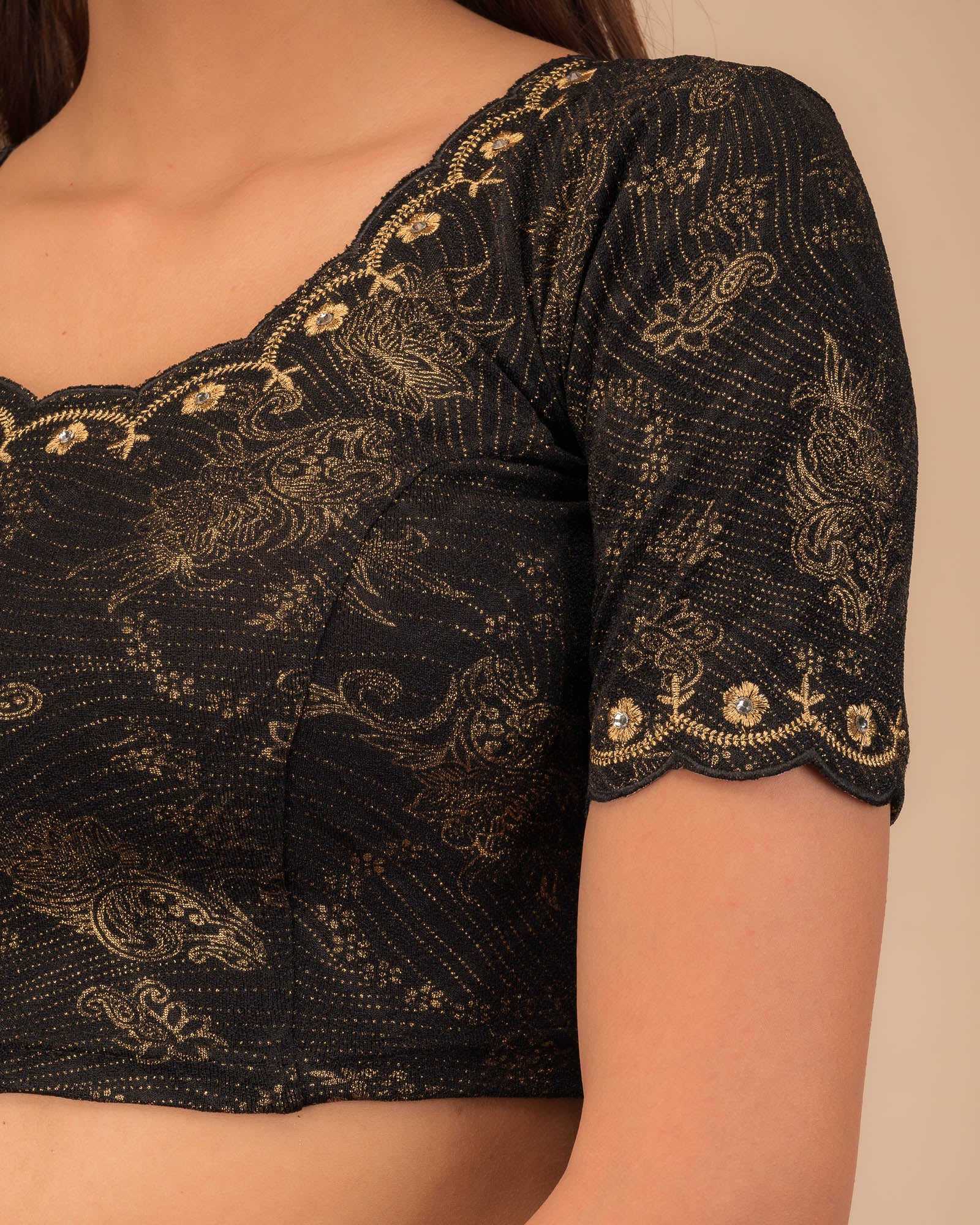 Close-up of jacquard knit with detailed embroidery.