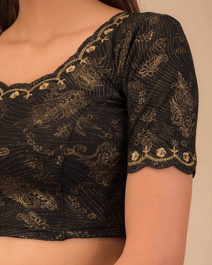 Close-up of jacquard knit with detailed embroidery.