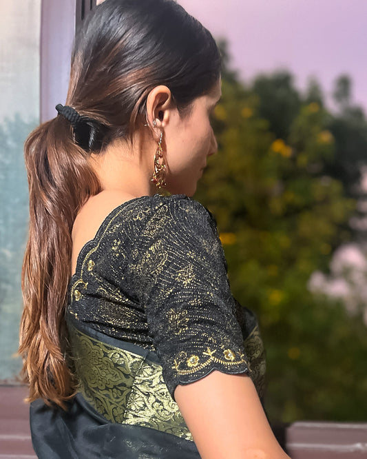 Model pairing the blouse with a saree for a festive-ready look.