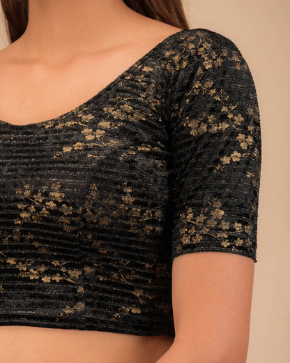 Close-up of the velvet fabric with metallic foil accents.