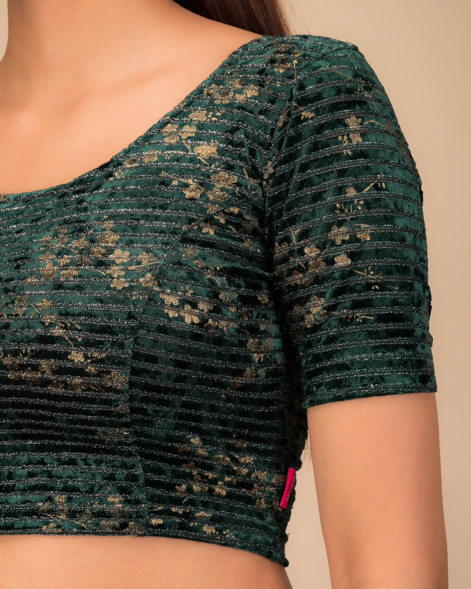 Close-up of the velvet fabric with metallic foil accents.