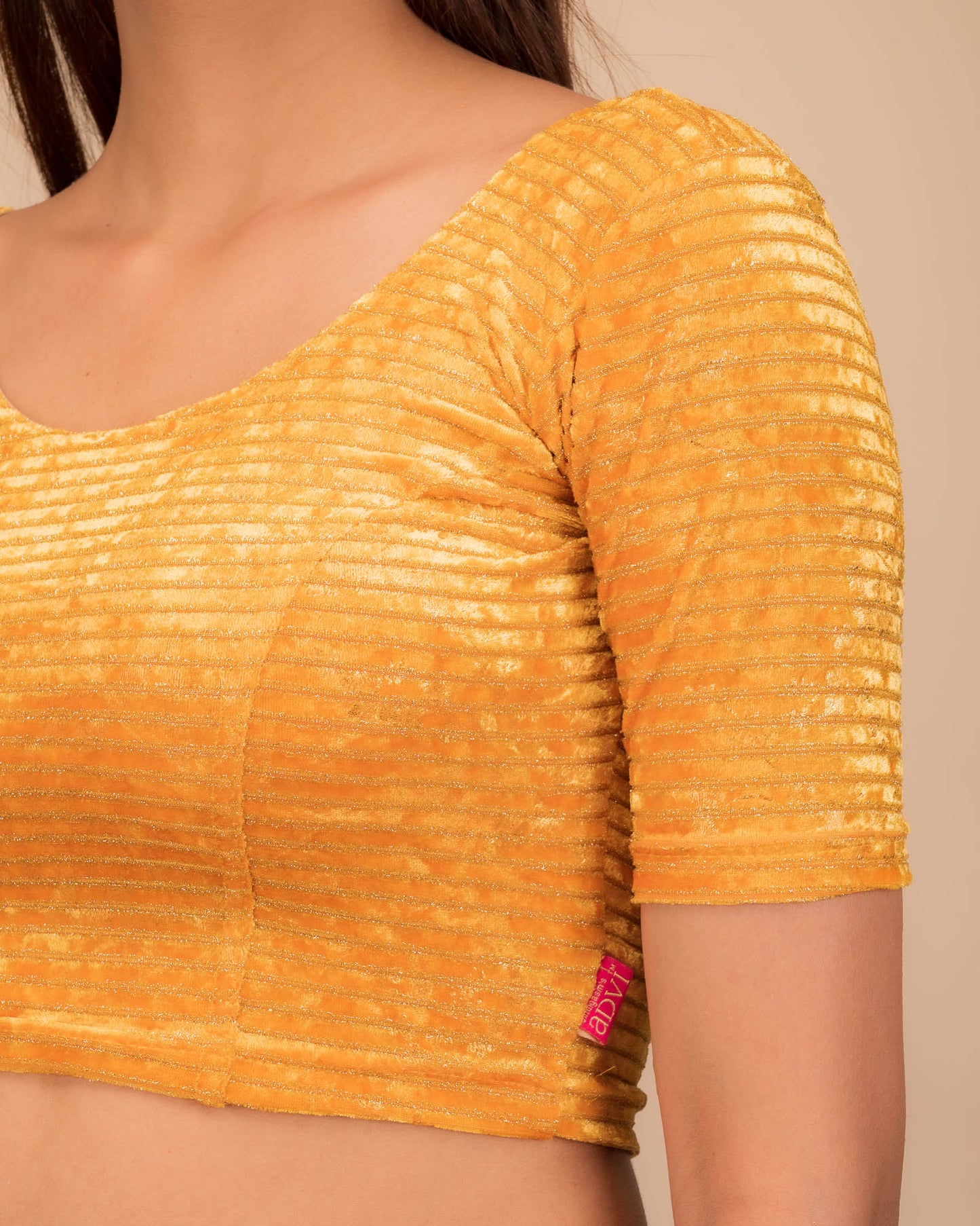 Close-up of the velvet fabric with metallic foil accents.