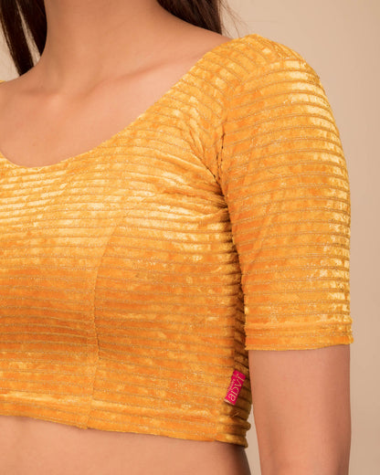 Close-up of the velvet fabric with metallic foil accents.