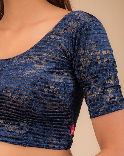Close-up of the velvet fabric with metallic foil accents.